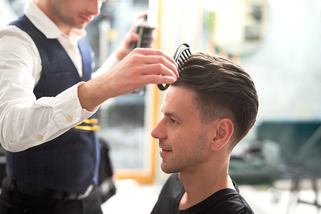 Barber is creating trendy hairstyle